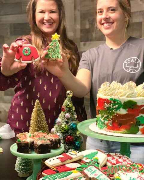 sami cone and courtney from baked on 8th in nashville with decorated christmas cookies