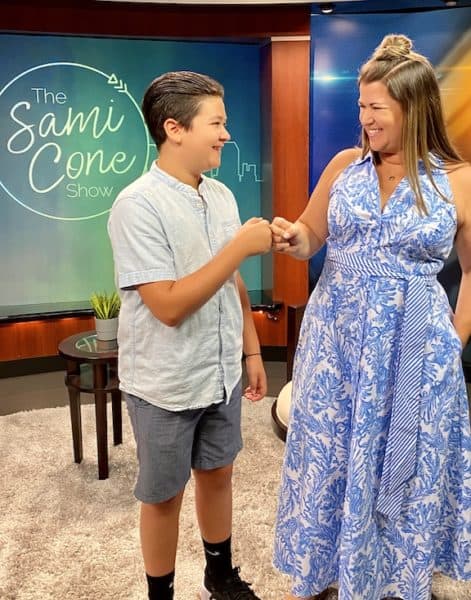 Britton Cone Sami Cone Show stage fist bump